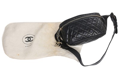 Lot 66 - A Chanel quilted navy lambskin leather bumbag, late 1980s-early 1990s