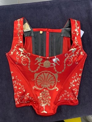 Lot 180 - A good Vivienne Westwood gold-stencilled red satin corset, probably 'Salon' collection, Spring-Summer 1992