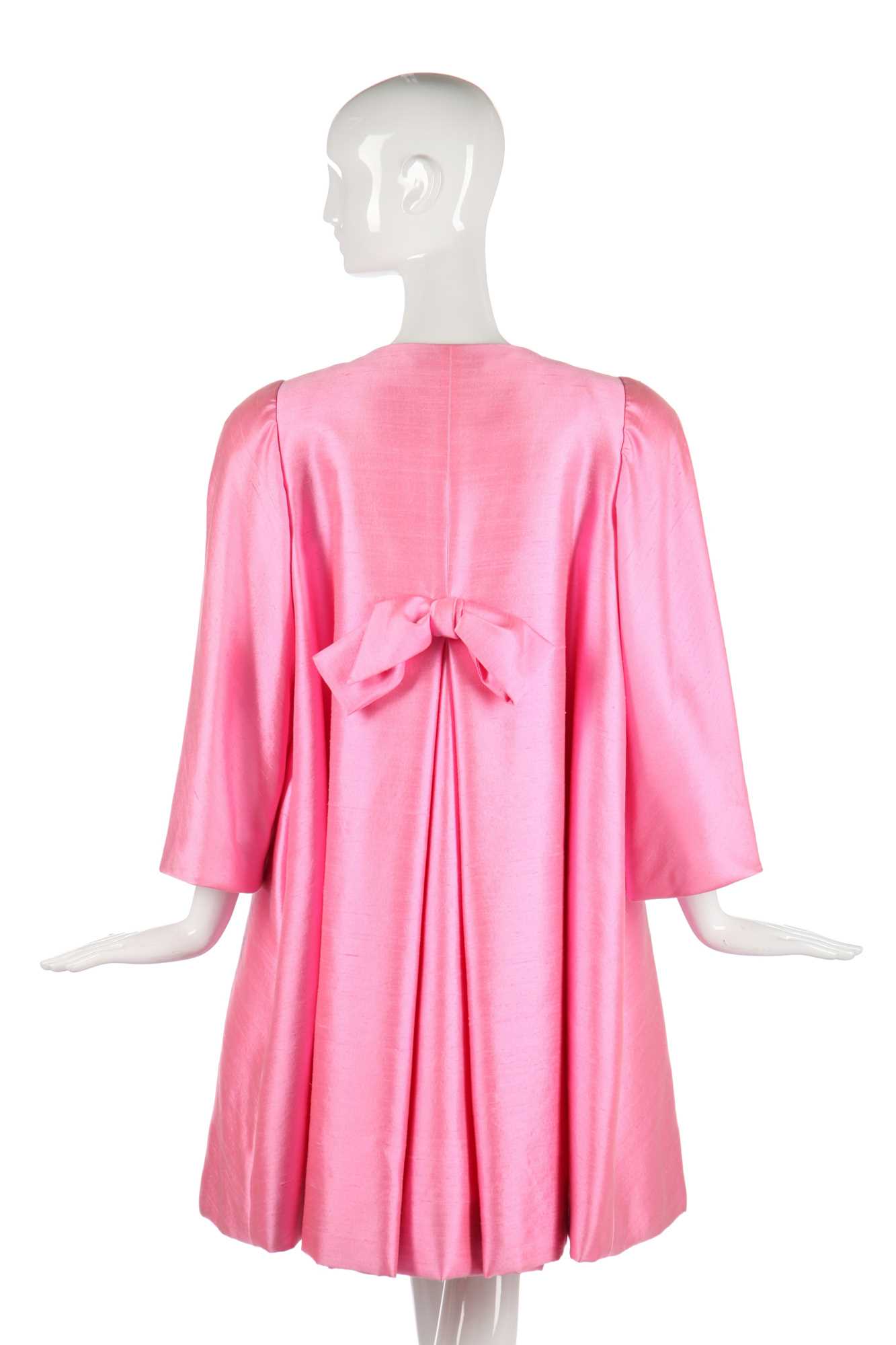 Lot 175 - A Scaasi bubblegum-pink raw-silk tent-coat, 1980s in a 1960s style