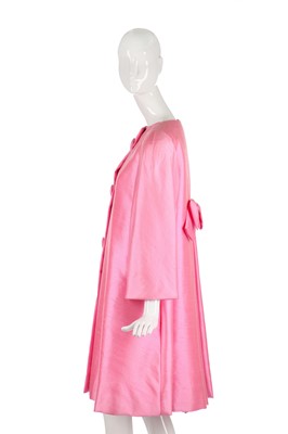 Lot 175 - A Scaasi bubblegum-pink raw-silk tent-coat, 1980s in a 1960s style