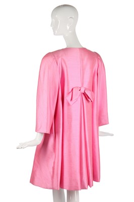 Lot 175 - A Scaasi bubblegum-pink raw-silk tent-coat, 1980s in a 1960s style