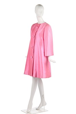 Lot 175 - A Scaasi bubblegum-pink raw-silk tent-coat, 1980s in a 1960s style