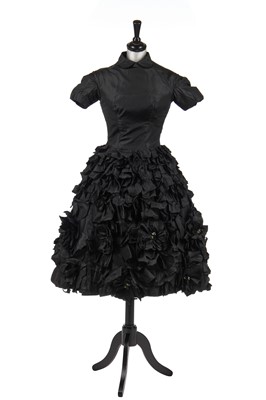 Lot 277 - An early Hubert de Givenchy black paper taffeta cocktail dress, circa 1952