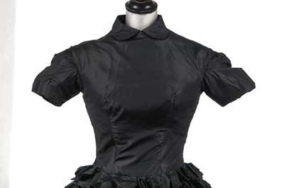 Lot 277 - An early Hubert de Givenchy black paper taffeta cocktail dress, circa 1952