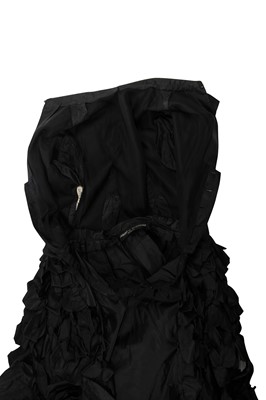 Lot 235 - An early Hubert de Givenchy black paper taffeta cocktail dress, circa 1952