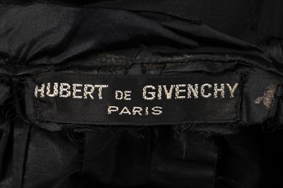 Lot 235 - An early Hubert de Givenchy black paper taffeta cocktail dress, circa 1952