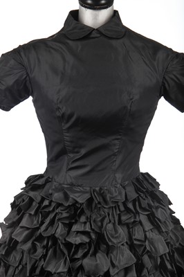 Lot 235 - An early Hubert de Givenchy black paper taffeta cocktail dress, circa 1952