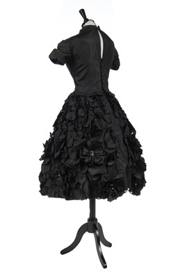 Lot 277 - An early Hubert de Givenchy black paper taffeta cocktail dress, circa 1952