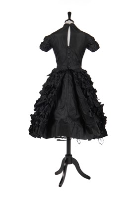 Lot 277 - An early Hubert de Givenchy black paper taffeta cocktail dress, circa 1952