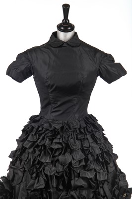 Lot 235 - An early Hubert de Givenchy black paper taffeta cocktail dress, circa 1952