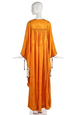 Lot 312 - A Thea Porter marigold-orange damask silk abaya, 1970s