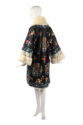 Lot 253 - An embroidered black satin and white rabbit fur evening coat, Chinese for the European market, late 1920s