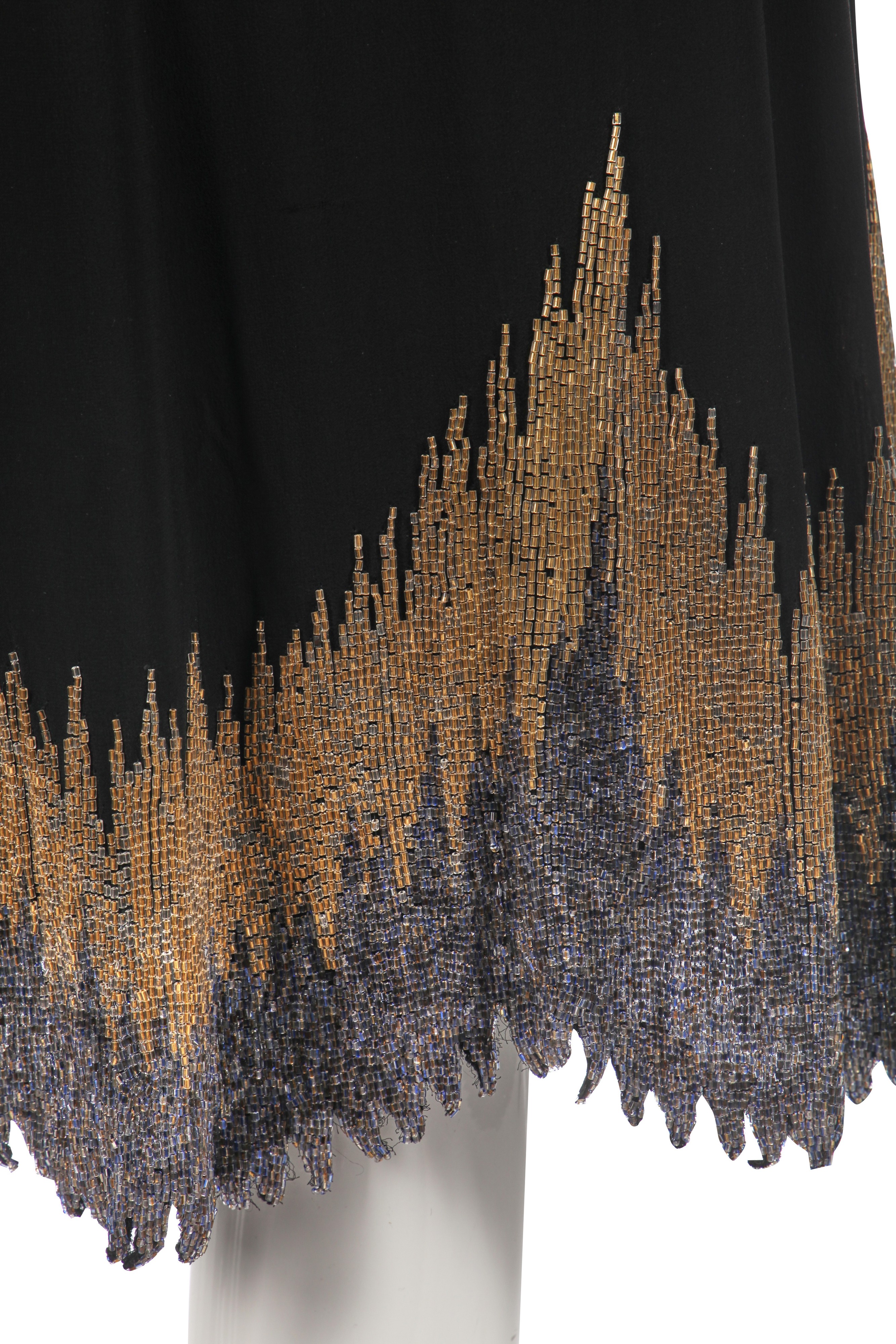 Lot 242 - A Chanel couture beaded black georgette