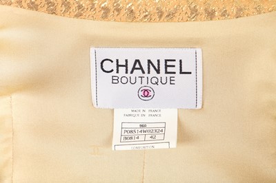 Lot 21 - A Chanel bouclé wool and apricot-gold lamé three-piece ensemble, Autumn-Winter 1996-97