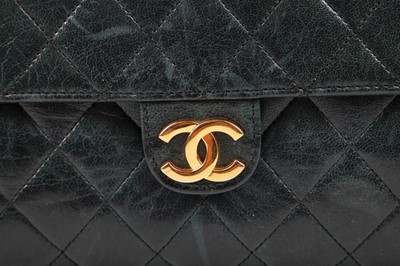 Lot 4 - A Chanel navy quilted lambskin leather flap bag, probably 1980s