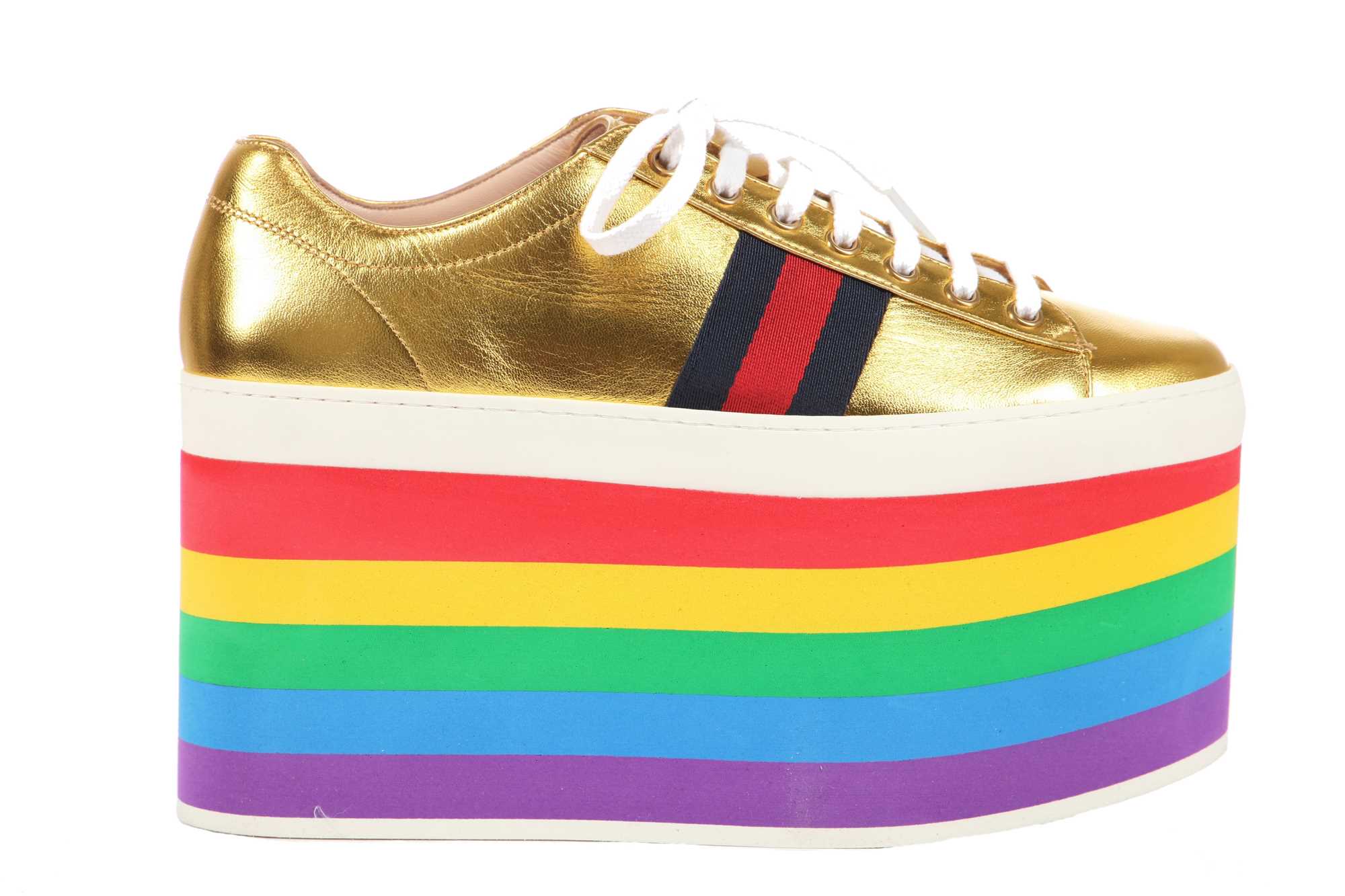 Lot 100 - A pair of Gucci gold leather trainers with