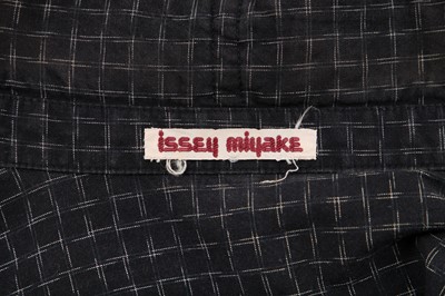 Lot 344 - An Issey Miyake textured wool jacket in shades of blue-grey and black, circa 1983