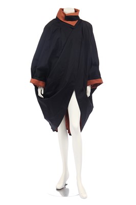 Lot 188 - An Issey Miyake two-piece ensemble in shades of brick-orange and black, circa 1977