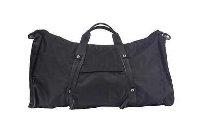 Lot 184 - An Issey Miyake black nylon convertible duffle bag/backpack, probably 1990s