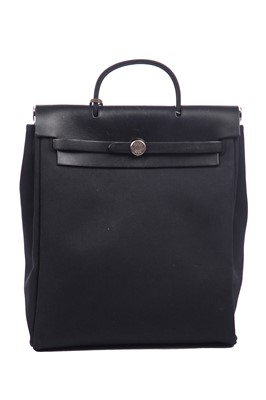Lot 54 - An Hermès Herbag in black canvas and leather, modern