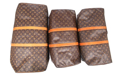 Lot 58 - Three Louis Vuitton monogrammed canvas leather holdalls