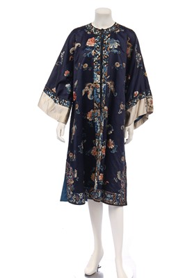 Lot 493 - An embroidered blue satin chang-fu, Chinese, early 20th century