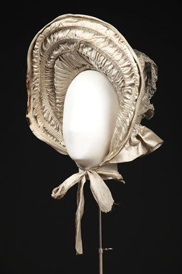 Lot 424 - An ivory satin bridal bonnet,  late 1830s