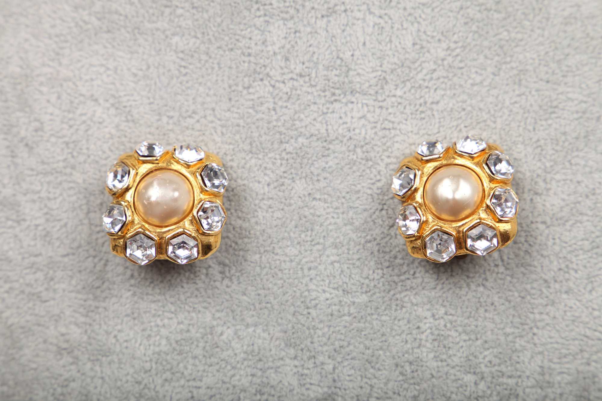 Lot 23 - A pair of Chanel gilt metal earrings with cut brilliants, circa 1990