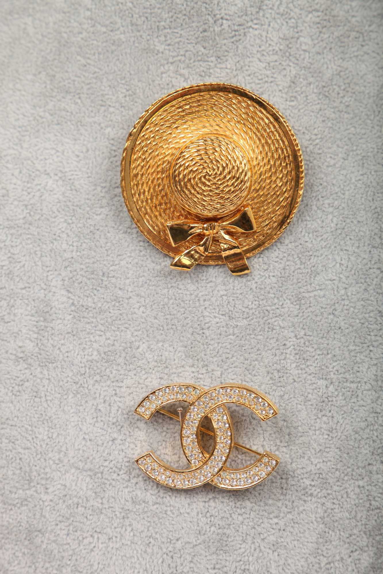 Lot 28 - Two Chanel gilt metal brooches, 1980s-early 1990s