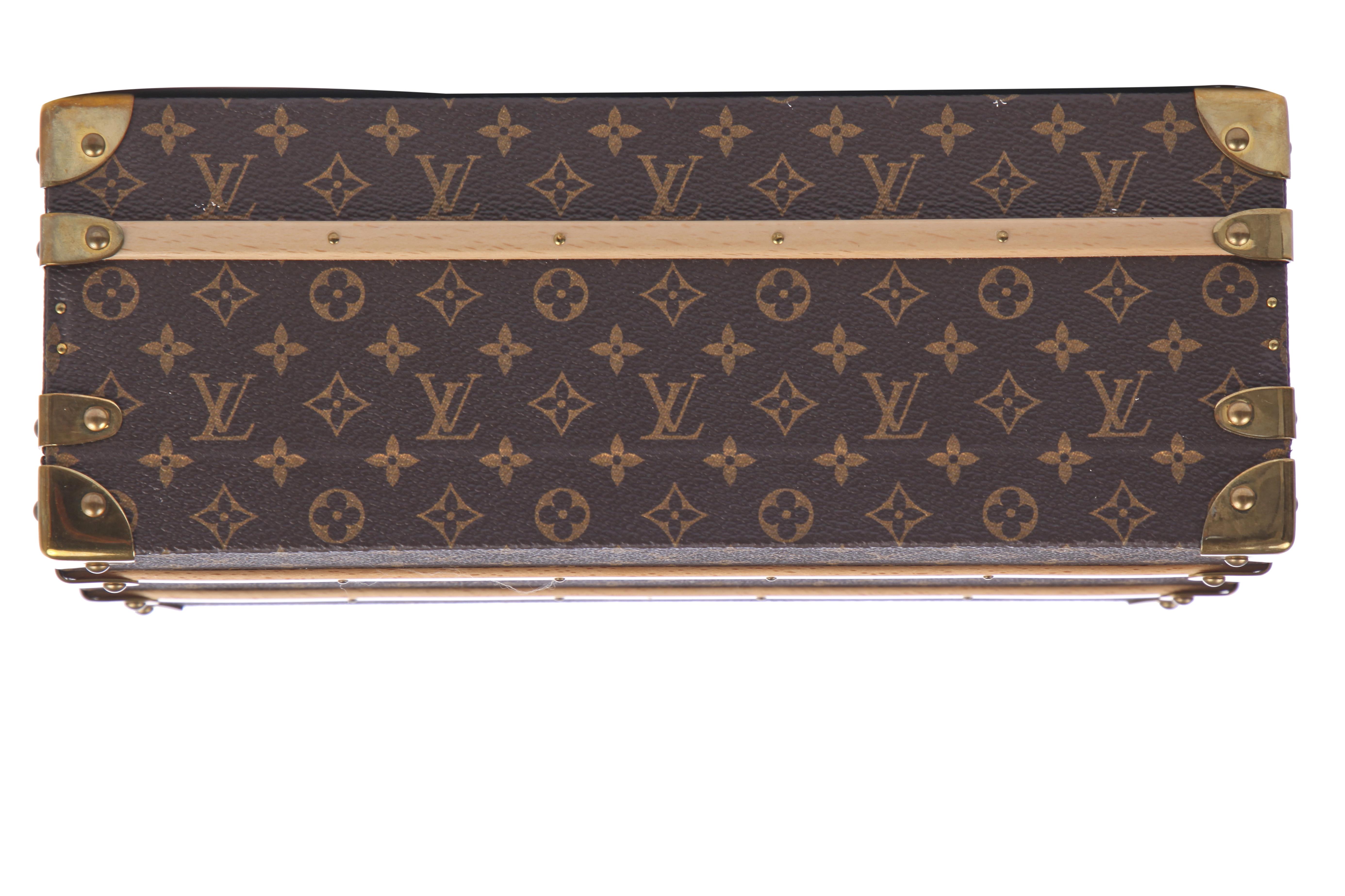 Sold at Auction: A Louis Vuitton leather and monogram canvas Alzer