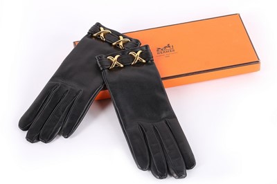 Lot 52 - A pair of Hermès black leather gloves, modern,...