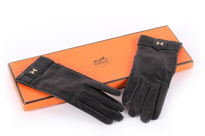 Lot 53 - A pair of Hermès black leather gloves, modern,...