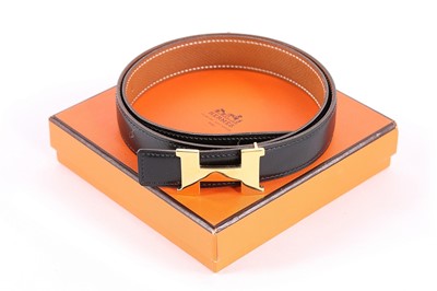 Lot 323 - An Hermès slim reversible leather belt, modern,...