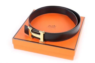 Lot 324 - An Hermès reversible leather belt, modern,...