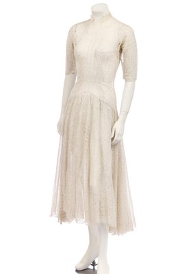 Lot 343 - A floral cut-work organza dress, circa 1950