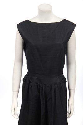 Lot 337 - A Balenciaga couture black slubbed silk dinner dress, 1953 but later altered