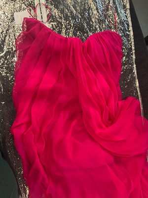 Lot 93 - An Alexander McQueen raspberry-pink silk chiffon evening gown, circa 2008