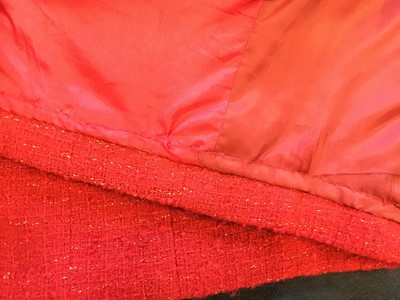 Lot 32 - A Chanel red bouclé wool suit, Autumn-Winter 1983-84