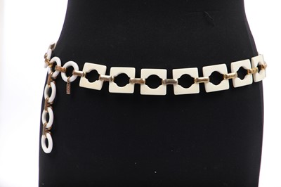 Lot 261 - An Yves Saint Laurent plastic and gilt linked belt, circa 1970