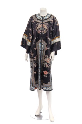 Lot 498 - An embroidered black satin chang-fu, 1920s