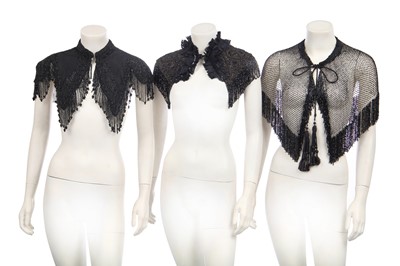 Lot 416 - Two black cut-work silk capelets and others, circa 1895