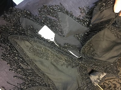 Lot 416 - Two black cut-work silk capelets and others, circa 1895