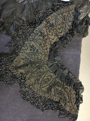 Lot 416 - Two black cut-work silk capelets and others, circa 1895