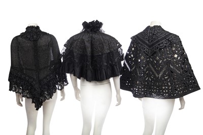 Lot 416 - Two black cut-work silk capelets and others, circa 1895