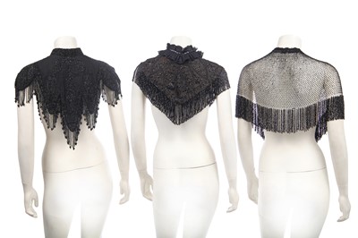 Lot 416 - Two black cut-work silk capelets and others, circa 1895