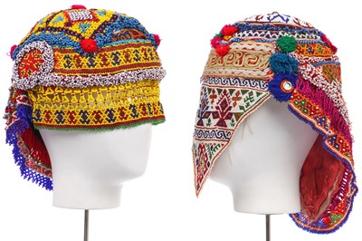 Lot 540 - Two Afghan beaded wedding hats, late 20th century