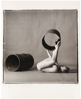 Lot 413 - Steven Klein gelatin silver print of a naked boy playing with metal drums, 1980s
