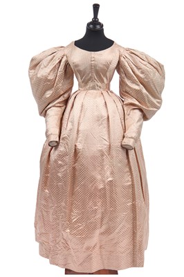 Lot 278 - A figured pink satin gown, circa 1830