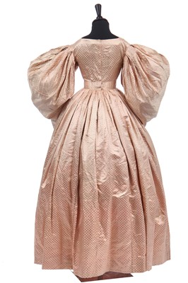 Lot 278 - A figured pink satin gown, circa 1830