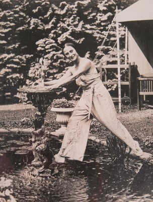 Lot 328 - A pair of rare photographs of Pavlova relaxing in the gardens of Ivy House,  circa 1930